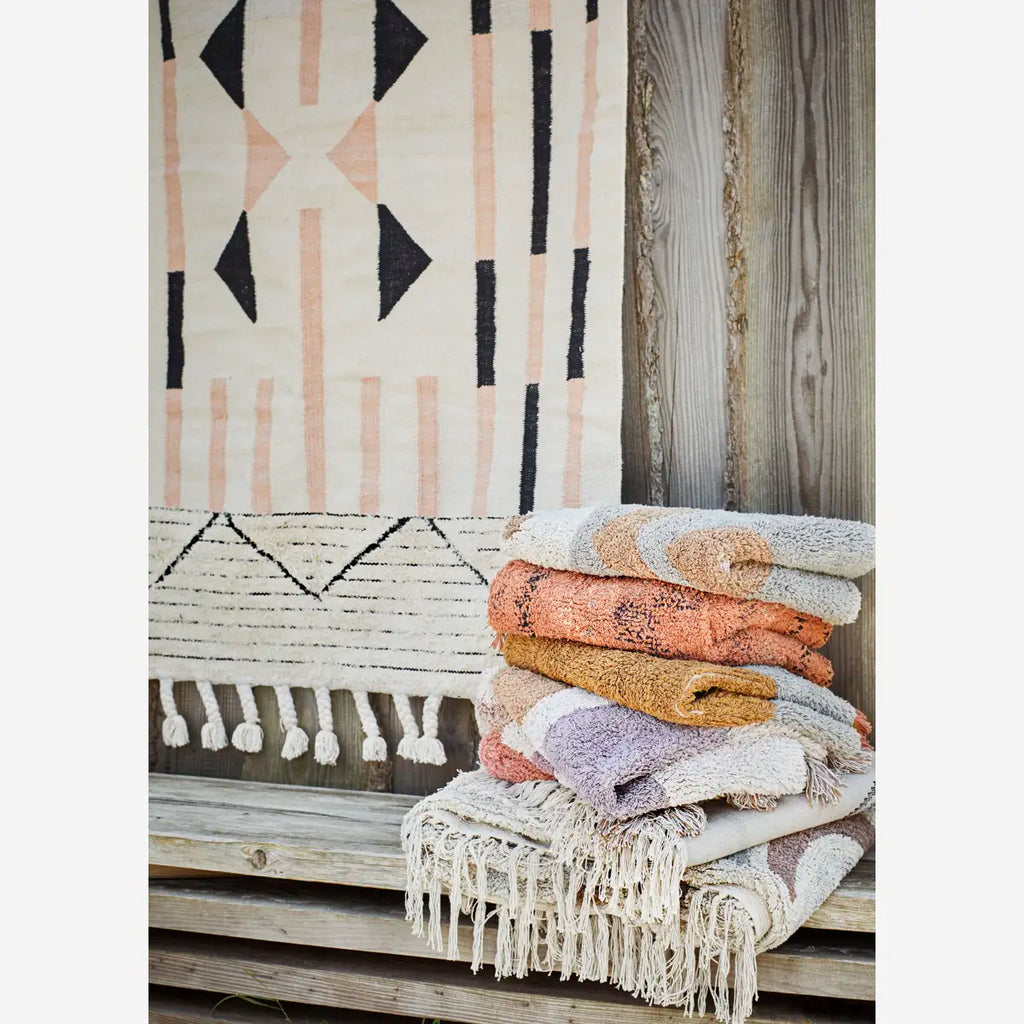 Handwoven frayed cotton rug